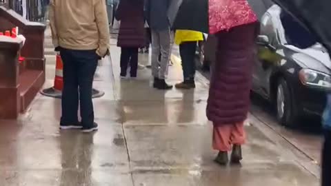 Perfectly Healthy People Idiotically Waiting In The Rain For A Rona Test