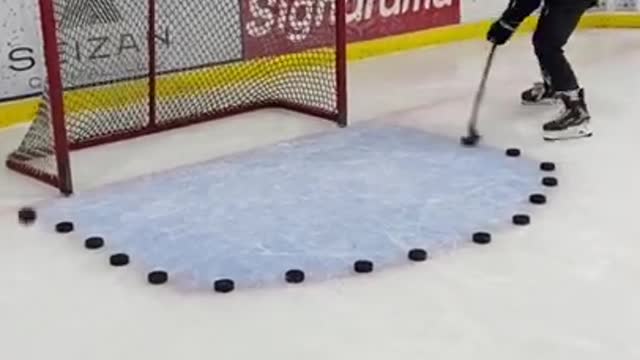 Man Hits Multiple Hockey Pucks Into Goal At High Speed