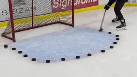 Man Hits Multiple Hockey Pucks Into Goal At High Speed