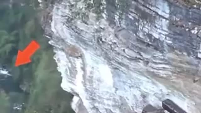 Drone spots hanging coffins on side of a mountain