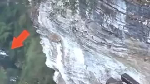 Drone spots hanging coffins on side of a mountain