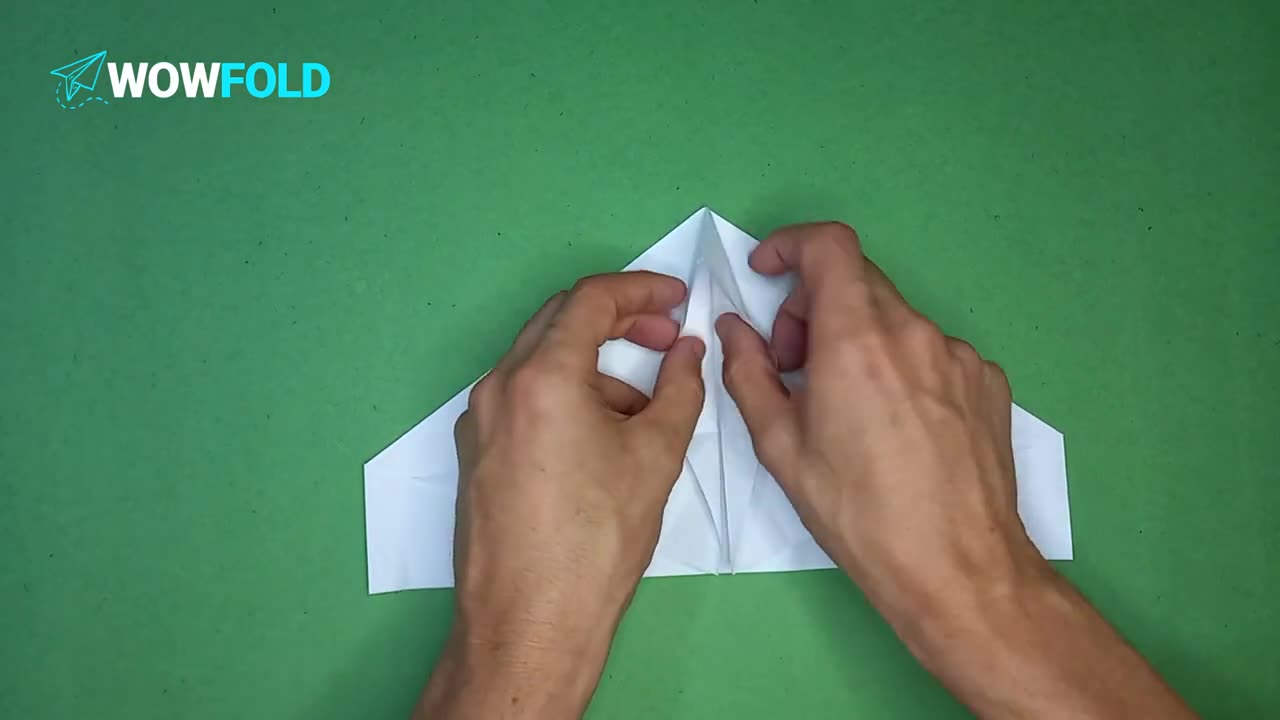 Open Last - folding a paper airplane