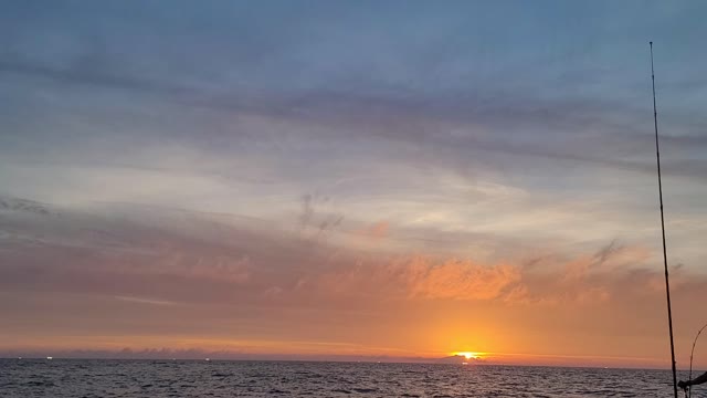 Sunset seen from the sea in front of Jeju Island