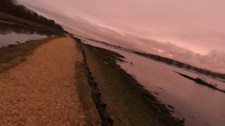 light is diminishing by a river