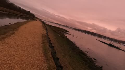 light is diminishing by a river