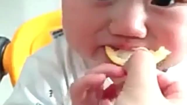 A baby's first taste of lemon