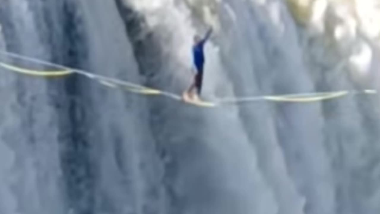 WALKING ON THE ROPE AT VICTORIA FALLS IN ZAMBIA