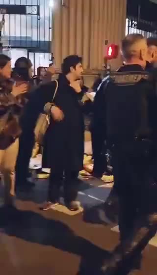 Some police officers in France remove their helmets and stop fighting with protesters.