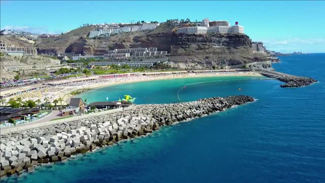 flying over the beautiful amadores beach at gran canaria