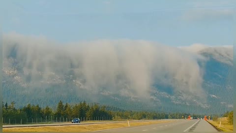 A Waterfall of Clouds in the Mountains