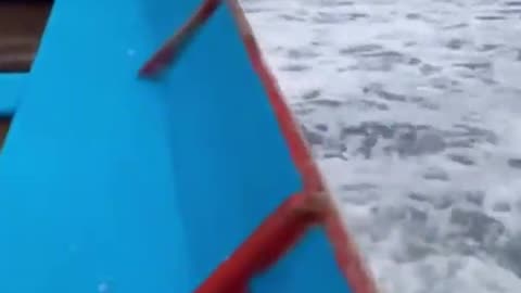 Wave takes boat and people with it