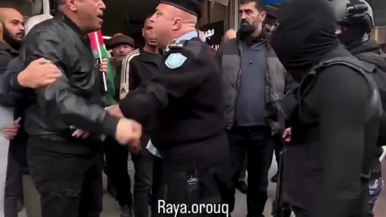 A Palestinian man in Jenin yells at Palestinian Authority police calling for unity