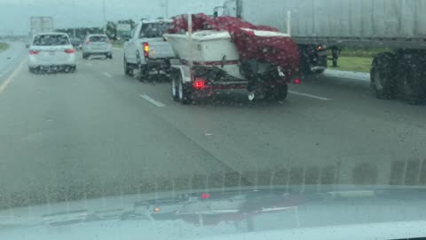 Shredded highway tarp