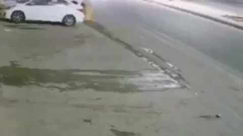 A car driver prevents another vehicle from Hitting a kid