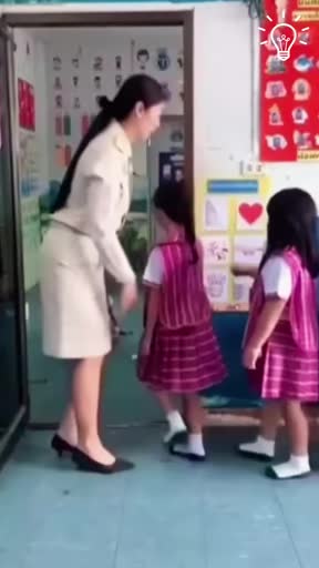 Teacher greets each kid with a dance move