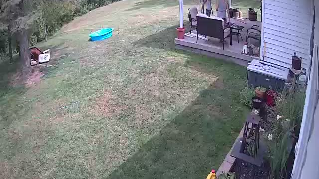 Mom Sitting on Bench Falls Backward off Patio