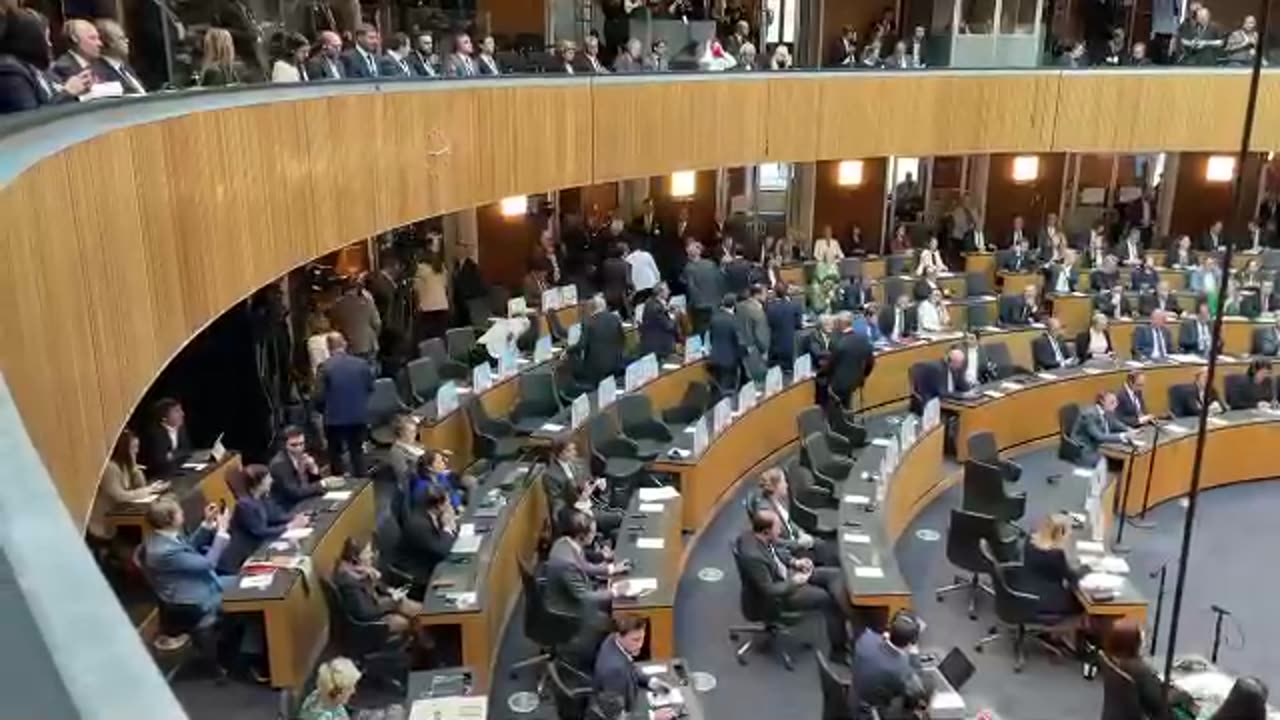 Austrian members of the parliament walk out in defiance when Zelenskiy starts his address.