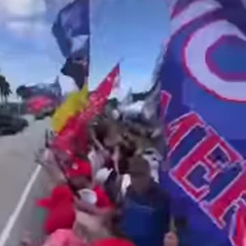 Fans scream and chant "We Love Trump" as former President Donald.