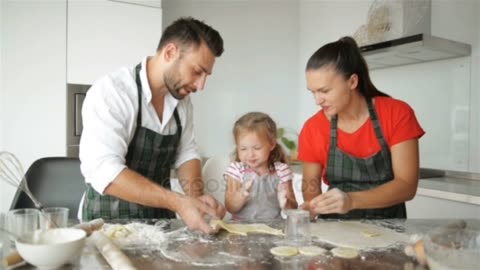 Cooking with parents little girl