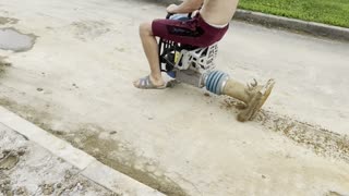 Construction Worker Takes Asphalt Compactor for a Drive