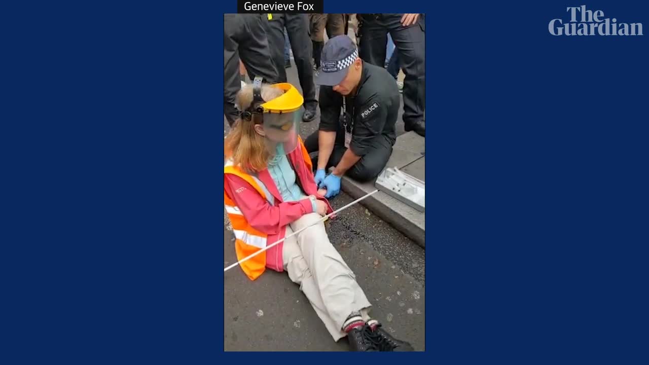 Just Stop Oil: protester glues hand to central London road