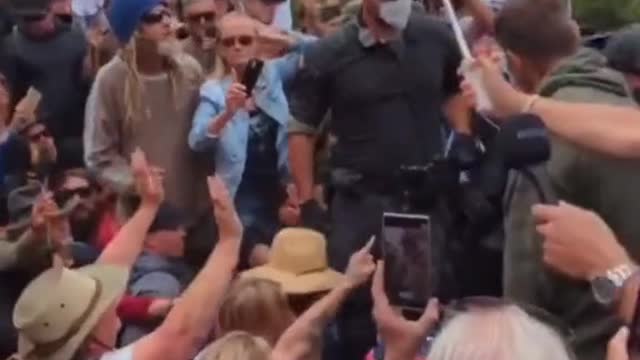Brain washed cops try to manhandle an elderly protestor. This is insanity...