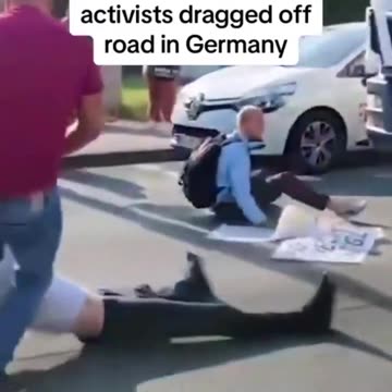 Climate change activists dragged off road by their hair in Germany short