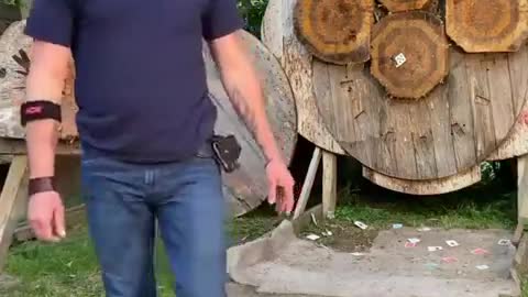 Man Throws Knife and Pins Playing Card to Target