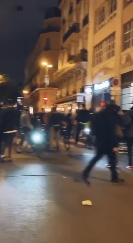 French riot police signal their support for the protesters.