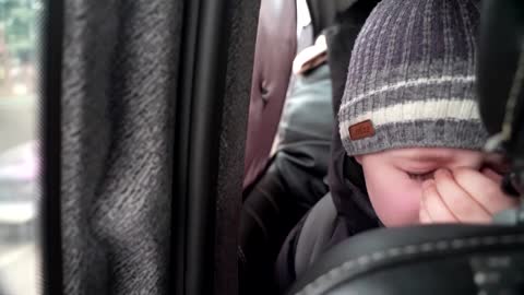'We left our Dad in Kyiv' -little boy chokes back tears