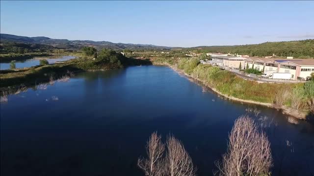 aerial drone footage flying over a lake in italy