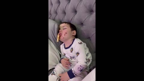 Baby boy adorably falls asleep while eating