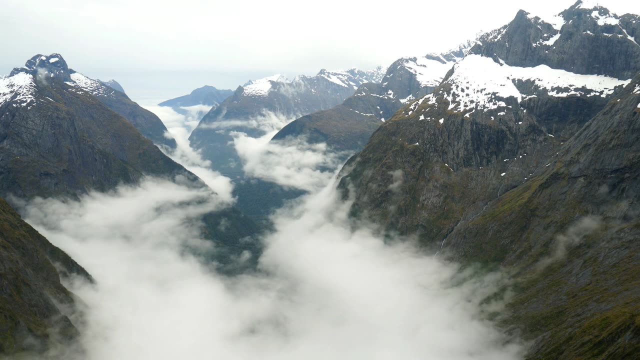 "Majestic Mountains and Ethereal Clouds: A Visual Symphony of Nature"