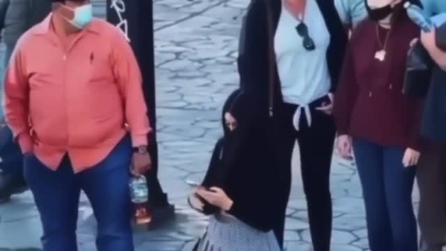 A social experiment in which a man photographs a girl under a skirt.