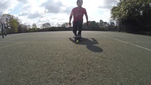 Guy Lands Golf Shot Hitting It With Skateboard While Driving a Bicycle