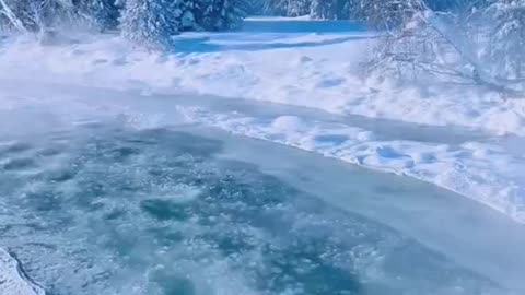 The river washes the snow