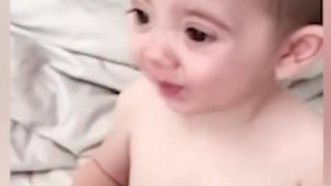 funny baby playing happily