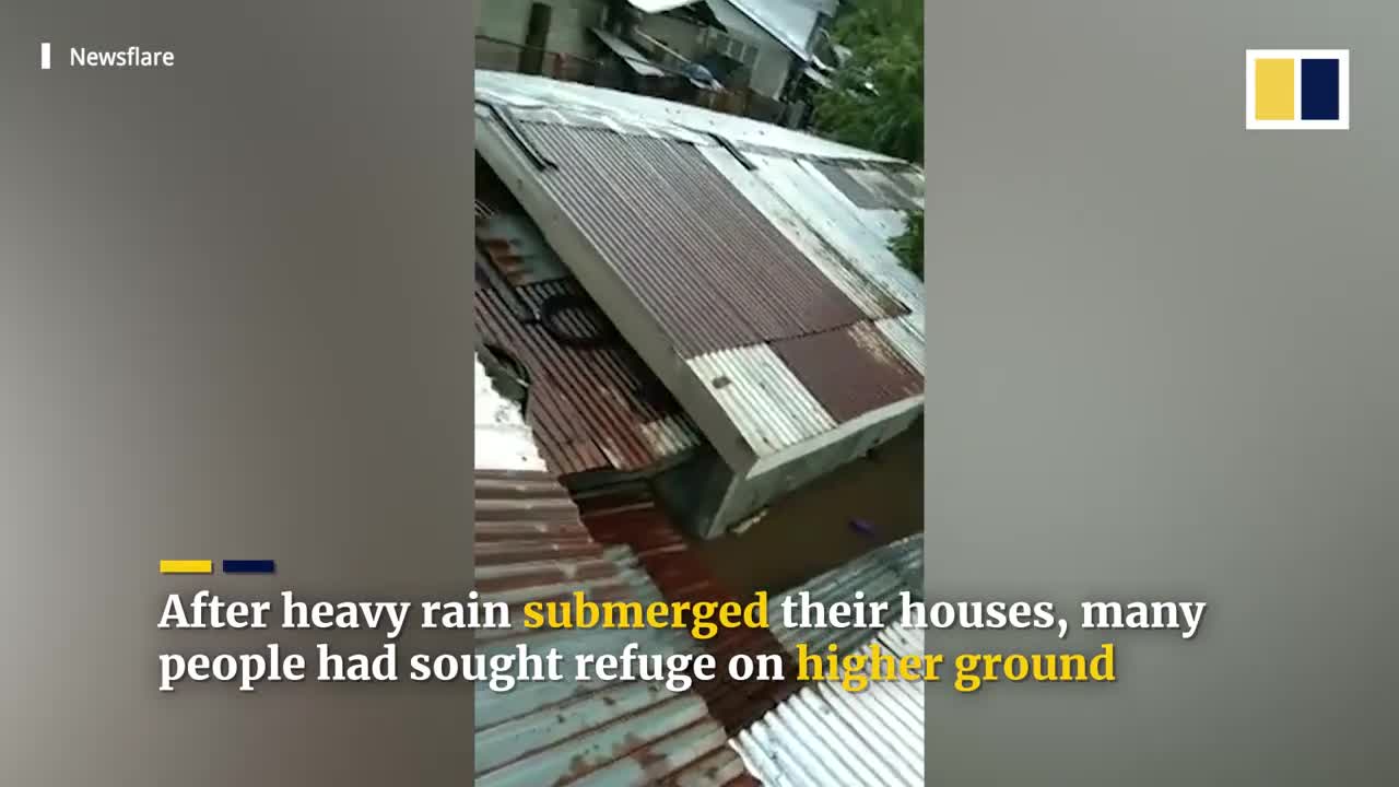 Terrified residents cry for help from roofs of flooded houses in Philippines
