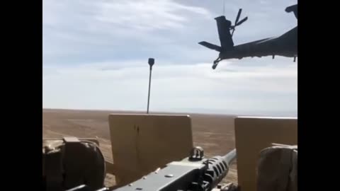 Slow Mo Footage of Apache Gunship Buzzing US Convoy In Syria.