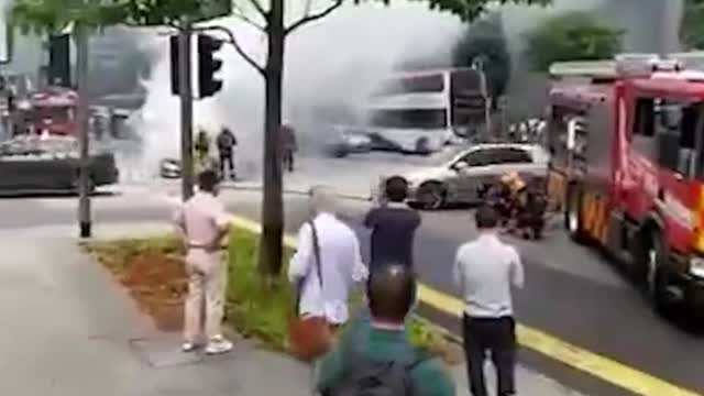 Burning Mercedes seen at junction outside Lau Pa Sat