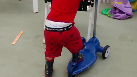 baby on scooter