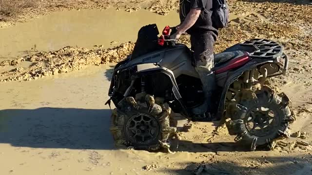 ATV Falls Over in Mud Puddle