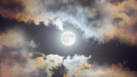 Full moon shining the clouds