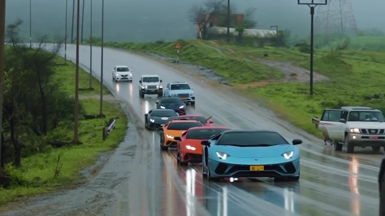 Parade of luxury cars under the divine rain