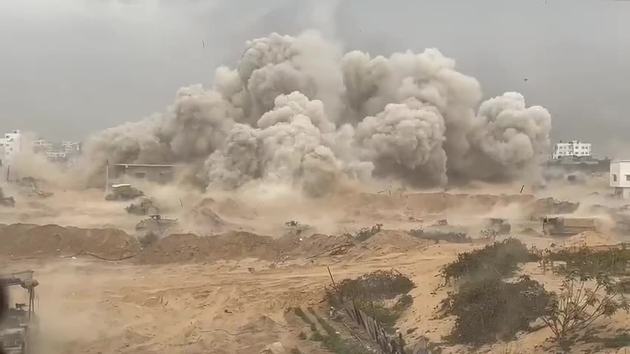 The IDF Israel forces blowing up a building in Gaza.