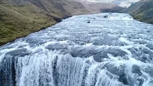 Unmanned flight over a waterfall