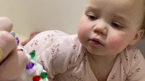 Baby Girl's Adorable Reaction to Light-Up Christmas Ornament