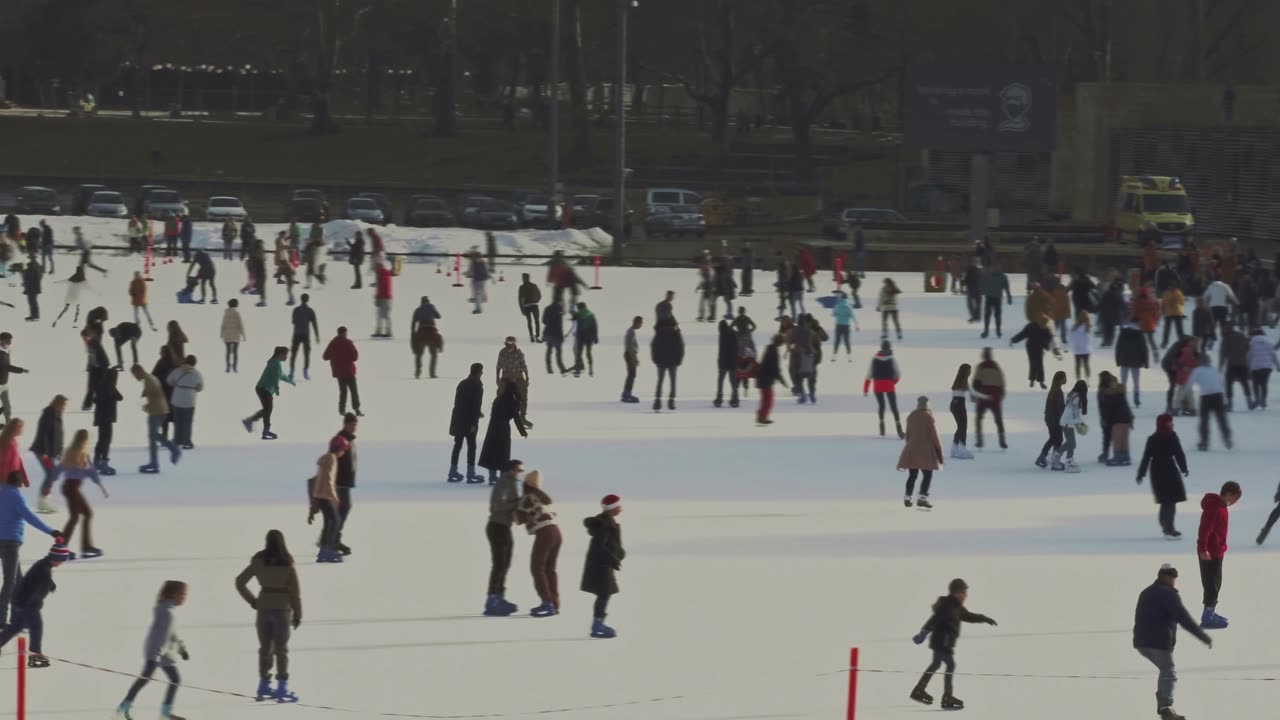 People Having Fun Skating On Ice