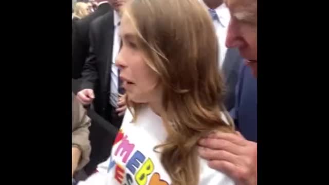 Joe Biden grabs a young girl by the shoulder and tells her “no serious guys till your 30”