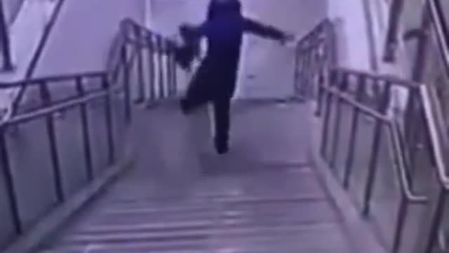 woman fall down a flight of stairs